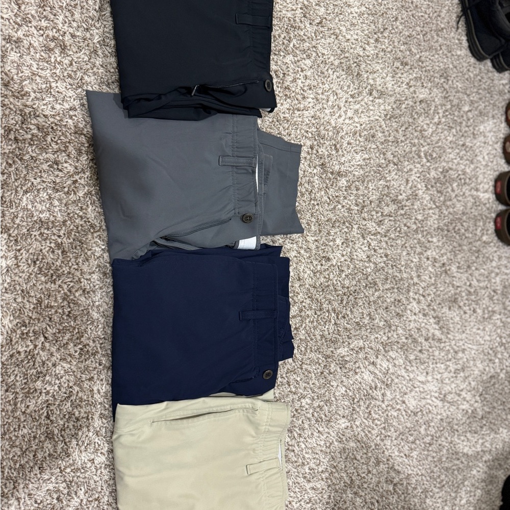 This listing is 4 pairs of UA drive under armor tapered pants all in size 30x30